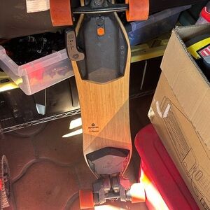 Boosted Electric Skateboard with Orange Wheels